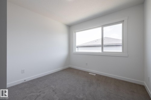 #21 7020 Keswick Cm Sw, Edmonton, AB - Indoor Photo Showing Other Room