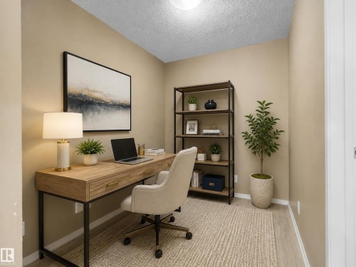 Dedicated room featuring light wood-finish flooring and neutral wall tones - #109 3207 James Mowatt Tr Sw, Edmonton, AB - Indoor Photo Showing Office