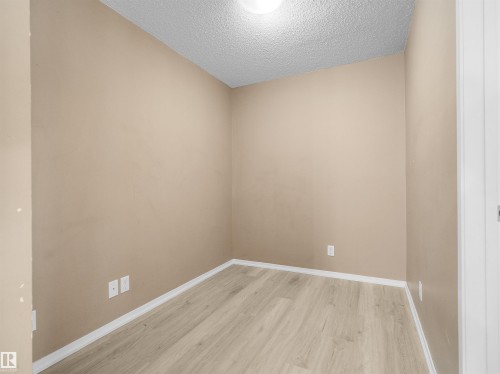 Image quality insufficient for description - #109 3207 James Mowatt Tr Sw, Edmonton, AB - Indoor Photo Showing Other Room