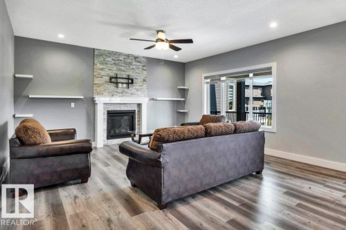 4403 Triomphe Gate, Beaumont, AB - Indoor Photo Showing Living Room With Fireplace