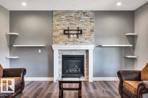 4403 Triomphe Gate, Beaumont, AB - Indoor Photo Showing Other Room With Fireplace