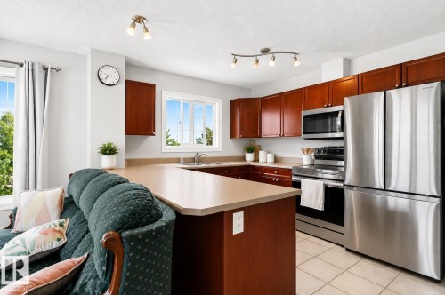 #411 4407 23 St Nw, Edmonton, AB - Indoor Photo Showing Kitchen With Stainless Steel Kitchen