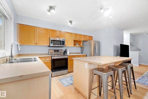 #6 12050 17 Av Sw, Edmonton, AB - Indoor Photo Showing Kitchen With Double Sink