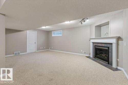 3 Holly Place, St. Albert, AB - Indoor Photo Showing Other Room With Fireplace