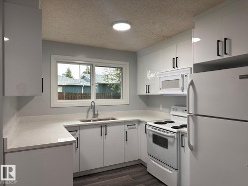 2613 105A Street Northwest, Edmonton, AB - Indoor Photo Showing Kitchen With Double Sink