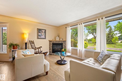 7215 96B Avenue Nw, Edmonton, AB - Indoor Photo Showing Living Room With Fireplace