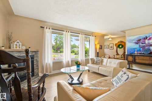 7215 96B Avenue Nw, Edmonton, AB - Indoor Photo Showing Living Room With Fireplace