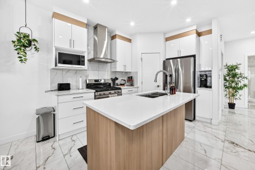 3605 41 Avenue, Beaumont, AB - Indoor Photo Showing Kitchen With Double Sink With Upgraded Kitchen