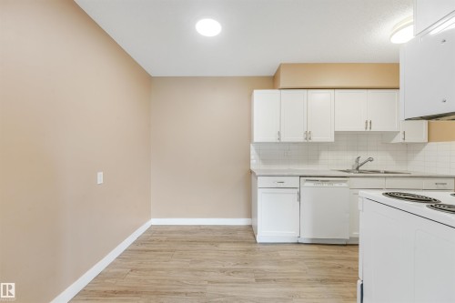 #8 14120 80 St Nw, Edmonton, AB - Indoor Photo Showing Kitchen With Double Sink