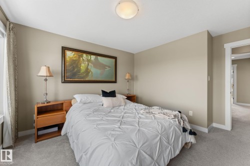 Carpeted room with neutral wall tones and white trim - 3413 Cameron Heights Cove Nw, Edmonton, AB - Indoor Photo Showing Bedroom