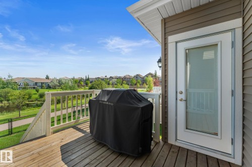 Outdoor deck with wood-finish flooring and white railing - 3413 Cameron Heights Cove Nw, Edmonton, AB - Outdoor With Deck Patio Veranda With Exterior