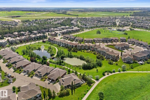 Expansive residential community featuring a variety of housing styles, abundant green spaces, and multiple ponds - 3413 Cameron Heights Cove Nw, Edmonton, AB - Outdoor With View