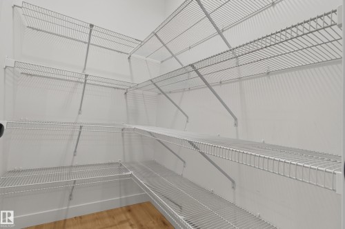 Integrated wire shelving system provides organized storage - 1534 Plum Circle Circle Sw, Edmonton, AB - Indoor With Storage
