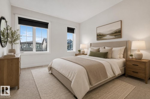 Bright bedroom featuring twin pane windows with grids, neutral wall tones, and plush carpeting - 1534 Plum Circle Circle Sw, Edmonton, AB - Indoor Photo Showing Bedroom