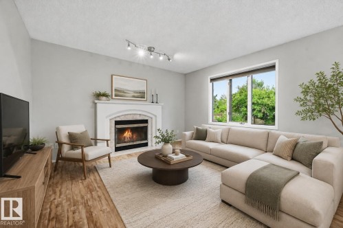 Virtually Staged - 219 Buchanan Close Nw, Edmonton, AB - Indoor Photo Showing Living Room With Fireplace