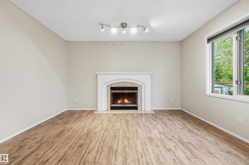219 Buchanan Close Nw, Edmonton, AB - Indoor Photo Showing Living Room With Fireplace