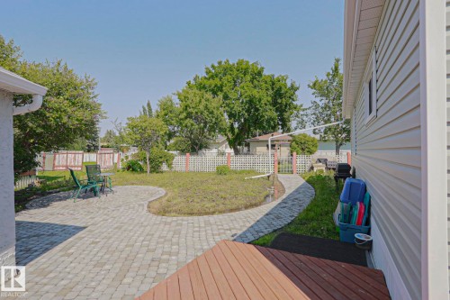 Spacious backyard featuring a large paver patio, a curved paver walkway, and a privacy fence - 137 Lee Ridge Road Nw, Edmonton, AB - Outdoor