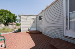Expansive wood-finish deck with a multi-level design and direct access to the home - 