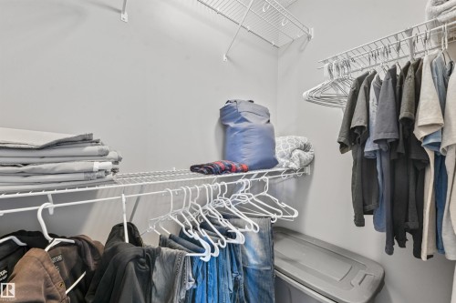 Walk-in closet featuring wire shelving and hanging rods - #40 1030 Chappelle Bv Sw, Edmonton, AB - Indoor With Storage