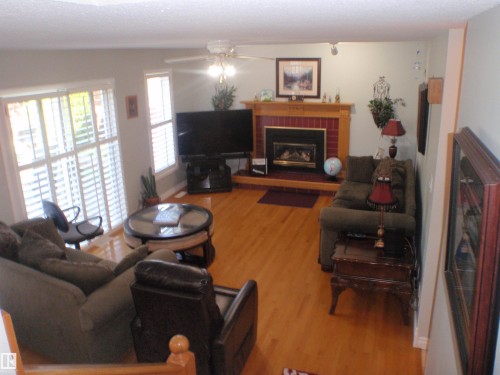 5802 53 Street, Barrhead, AB - Indoor Photo Showing Living Room With Fireplace