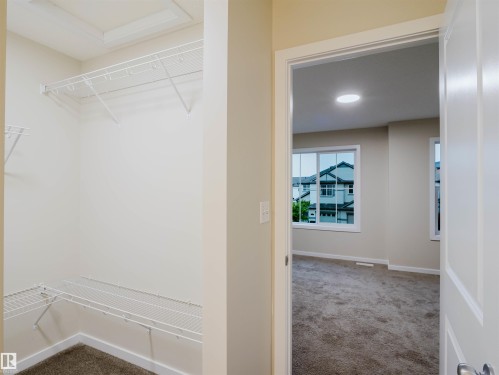 Walk-in closet with wire shelving system - 5407 14 Avenue Sw, Edmonton, AB - Indoor