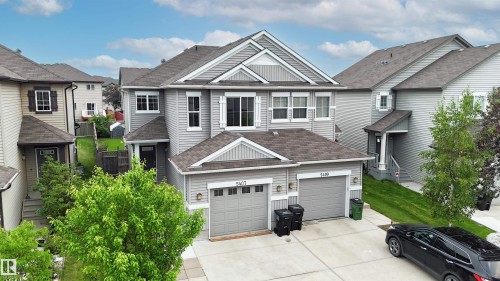Contemporary two-story residence featuring light gray siding and white trim accents - 5407 14 Avenue Sw, Edmonton, AB - Outdoor With Facade
