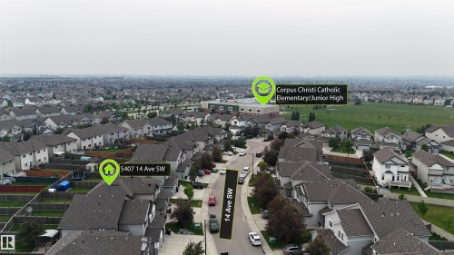 Aerial perspective showcasing a residential neighborhood with numerous single-family homes featuring asphalt shingle roofs - 5407 14 Avenue Sw, Edmonton, AB - Outdoor With View