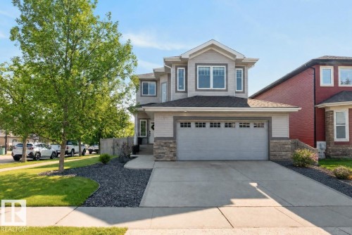 Two-story residence featuring light gray siding and stone accents - 109 Selkirk Place, Leduc, AB - Outdoor With Facade