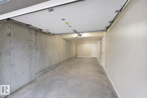 Digitally enhanced image shown. Personal belongings have been removed for presentation purposes only. - 2107 Casselman Link Sw, Edmonton, AB - Indoor Photo Showing Garage