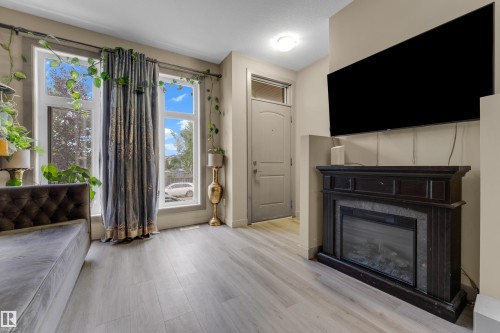 2107 Casselman Link Sw, Edmonton, AB - Indoor Photo Showing Living Room With Fireplace