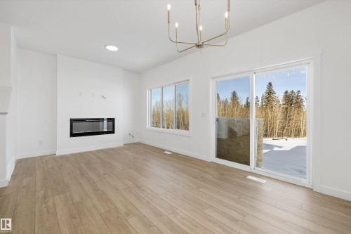 4184 Kinglet Drive Nw, Edmonton, AB - Indoor Photo Showing Living Room With Fireplace