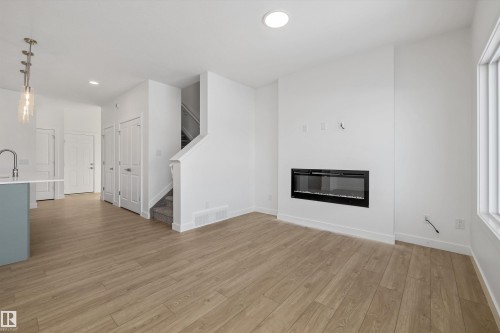 4184 Kinglet Drive Nw, Edmonton, AB - Indoor Photo Showing Living Room With Fireplace