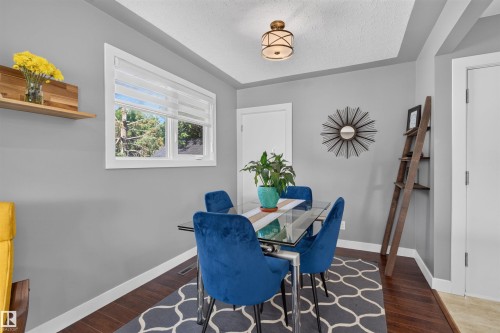 Recessed ceiling with an ornamental light fixture - 12136 135A Avenue Nw, Edmonton, AB - Indoor Photo Showing Dining Room