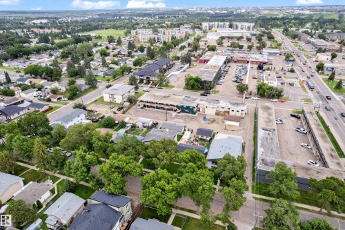 Extensive urban landscape featuring a mix of residential and commercial structures, mature trees, and developed infrastructure - 11817 37 Street Nw, Edmonton, AB - Outdoor With View