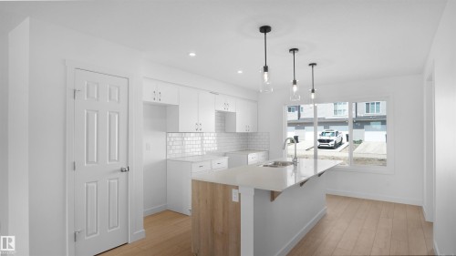 7387 Keeler Crescent Sw, Edmonton, AB - Indoor Photo Showing Kitchen With Upgraded Kitchen