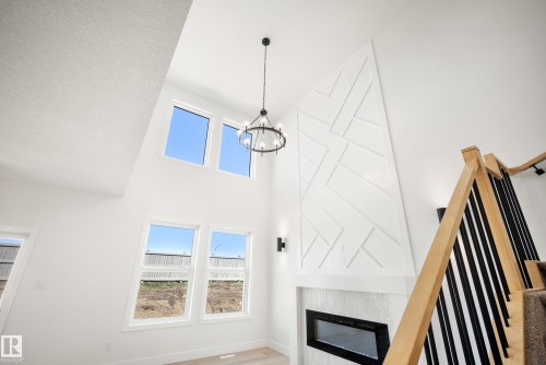 8533 223A Street Nw, Edmonton, AB - Indoor Photo Showing Other Room With Fireplace