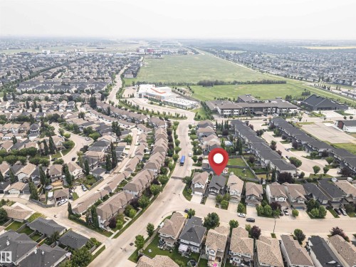 Aerial perspective of a developed residential area with a mix of single-family homes and townhouses - 2605 Anderson Crescent Sw, Edmonton, AB - Outdoor With View