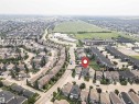 Aerial perspective of a developed residential area with a mix of single-family homes and townhouses - 2605 Anderson Crescent Sw, Edmonton, AB  - Outdoor With View 