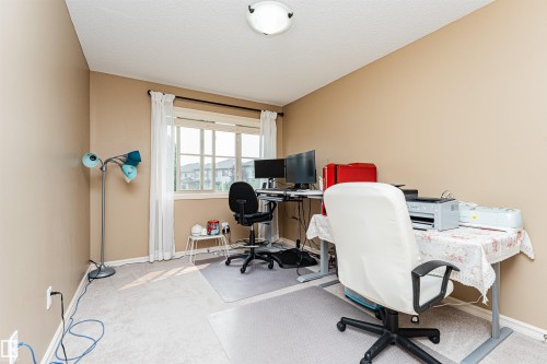 Neutral-toned walls complement the light-colored carpet flooring - 2605 Anderson Crescent Sw, Edmonton, AB - Indoor Photo Showing Office