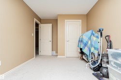 Neutral-toned walls and light-colored carpet create a versatile interior - 