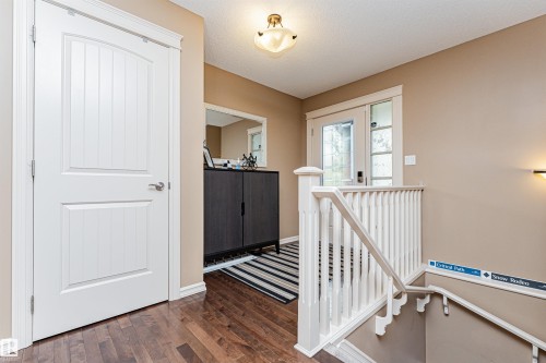 Wood-finish flooring throughout the entryway - 2605 Anderson Crescent Sw, Edmonton, AB - Indoor Photo Showing Other Room