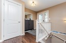 Wood-finish flooring throughout the entryway - 2605 Anderson Crescent Sw, Edmonton, AB  - Indoor Photo Showing Other Room 