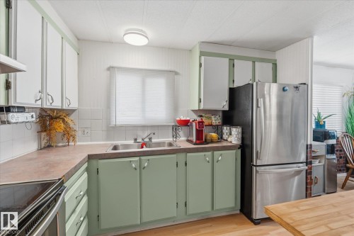 49 53222 Range Road 272, Rural Parkland County, AB - Indoor Photo Showing Kitchen With Double Sink