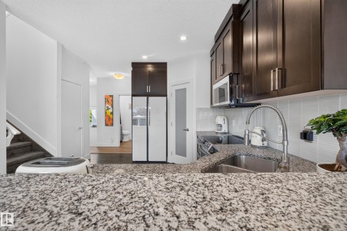 89 Sandalwood Place, Leduc, AB - Indoor Photo Showing Kitchen With Double Sink