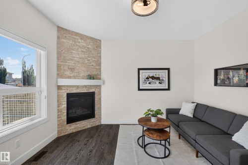 89 Sandalwood Place, Leduc, AB - Indoor Photo Showing Living Room With Fireplace