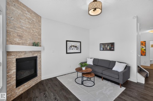 89 Sandalwood Place, Leduc, AB - Indoor Photo Showing Living Room With Fireplace