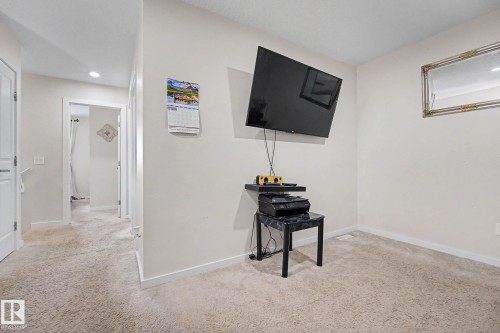 Neutral-toned carpeting throughout - 22419 80 Avenue Nw, Edmonton, AB - Indoor Photo Showing Other Room