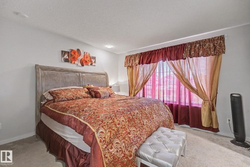 Spacious room featuring light gray walls, recessed lighting, and soft gray carpeting - 22419 80 Avenue Nw, Edmonton, AB - Indoor Photo Showing Bedroom