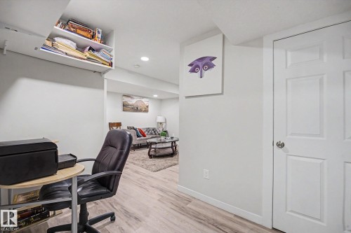 Flexible space with wood-finish flooring and recessed lighting - 22419 80 Avenue Nw, Edmonton, AB - Indoor Photo Showing Office