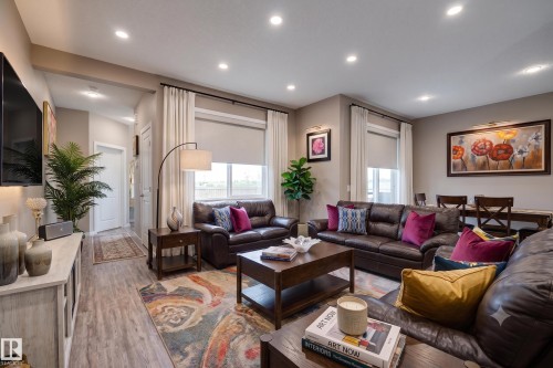 Open-concept living area featuring recessed lighting and wood-finish flooring - 22419 80 Avenue Nw, Edmonton, AB - Indoor Photo Showing Living Room